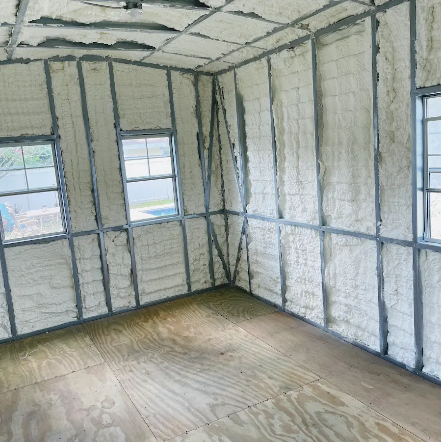 Closed-cell spray foam insulation applied to wall cavities in a residential project in Zuni Pueblo